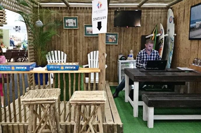 Man working in a wooden furniture inspired coffee shop