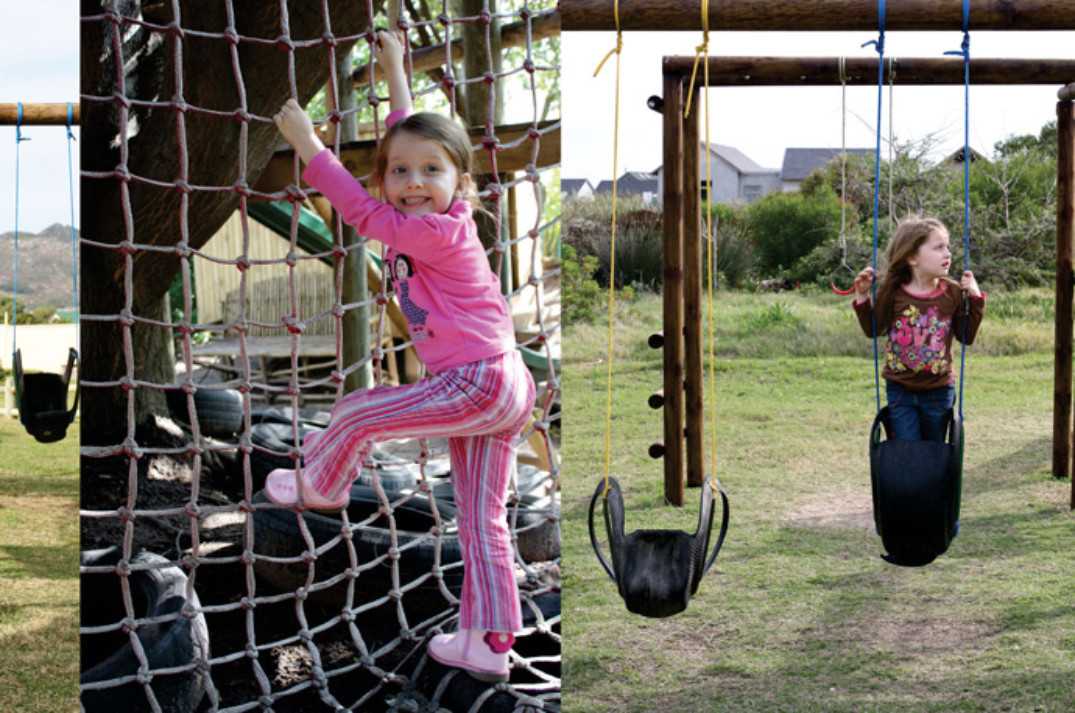 Girl climbing on a jungle gym and swinging on a swing