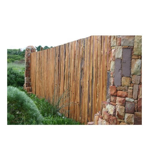 Rustic timber fence between stone pillars